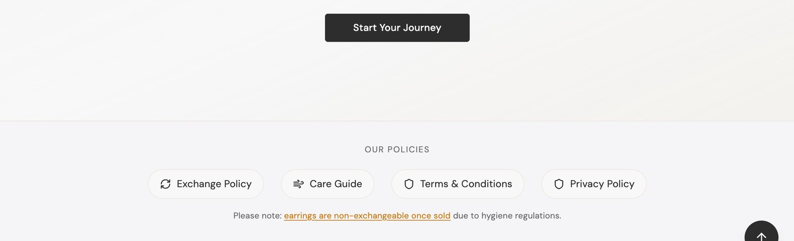 Before: only an Exchange Policy in the footer, no Returns Policy